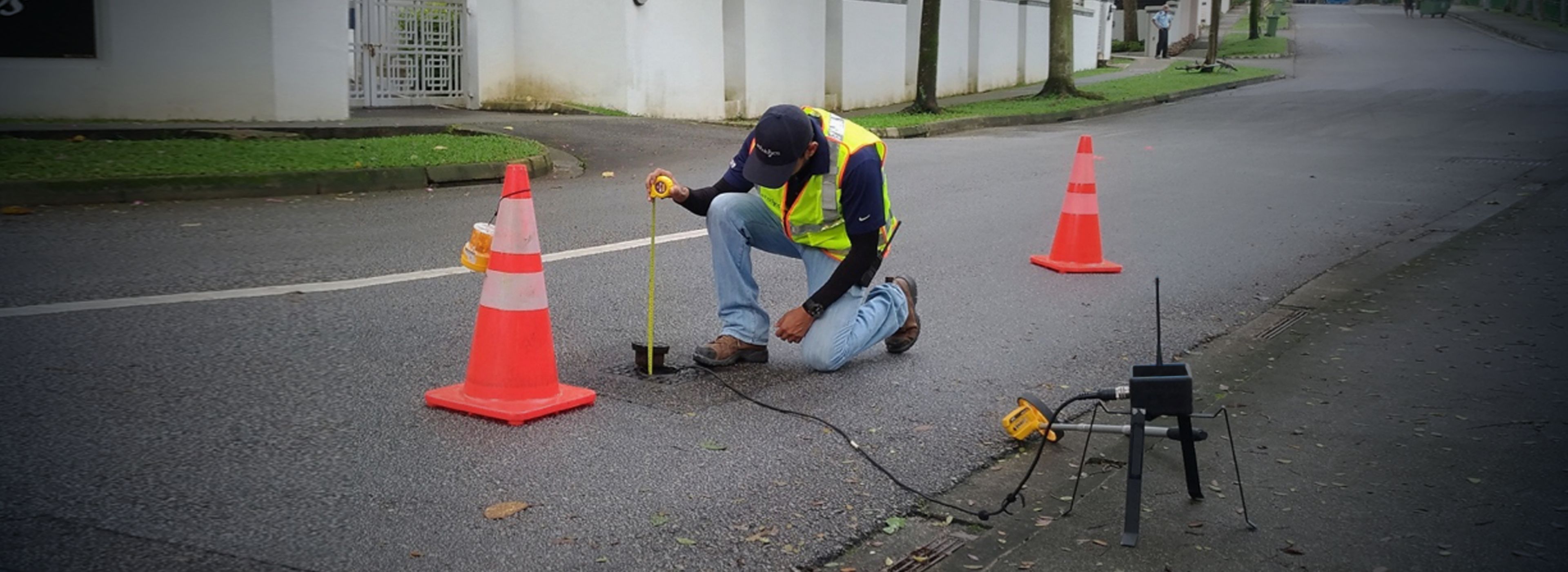 VODA.ai Condition Assessment, a man in a road check underground pipeline